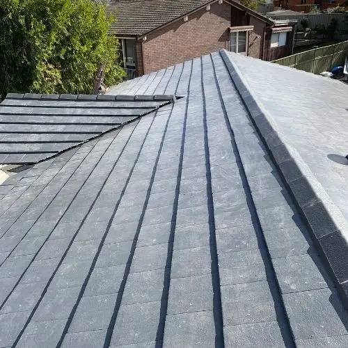 Charcoal-coated tile roof restoration — roofing work in Glenbrook, Blue Mountains NSW