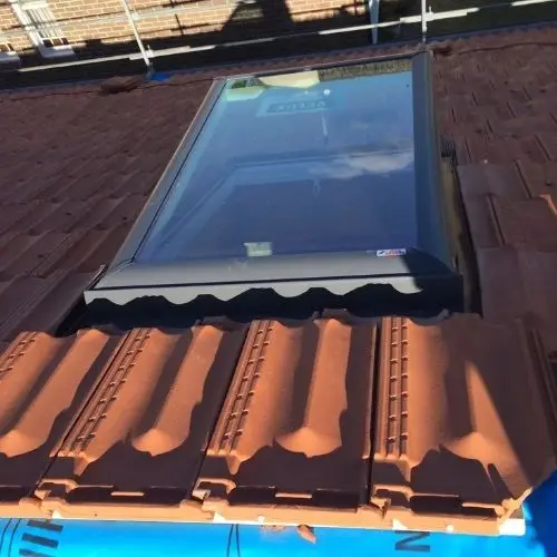 Terracotta tile roof with skylight installation — roofing work in Leura, Blue Mountains NSW